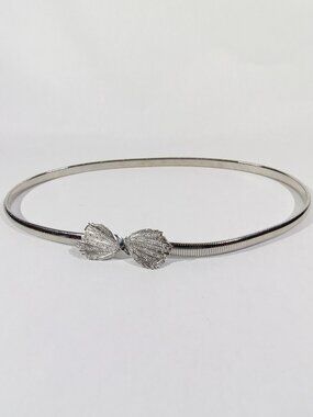 Silver-Tone Metal Stretch Coil Belt Features a Textured, Fan-Shaped Bow Buckle